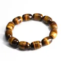 Natural tiger eye stone bracelet with polished barrel beads and golden brown cat-eye effect - 11x16mm / Tan