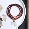 Detailed view of 5mm garnet bead bracelet featuring a jade leaf pendant and carvings - A3 Pixiu