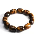 Natural tiger eye stone bracelet featuring eleven large barrel-shaped beads in brown - 13x18mm / Tan