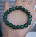 Natural dark green jadeite bead bracelet with 19 translucent polished round stones - Oily Green Round Bead Style