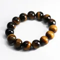 Natural tiger eye stone beaded bracelet with golden brown stripes and cat-eye effect - 14mm Bead Diameter
