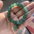 Natural green Burmese jadeite beaded bracelet featuring a Pixiu stone lucky charm - Oily Green Beads Style (Grade A Charm)