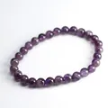 Polished dark purple natural amethyst bead bracelet for women on white background - 6mm