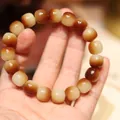 Bodhi-zaden armband met witte en bruine kralen in kleurverloop in trommelvorm - Tweekleurige Suiker Jade Vatkraal