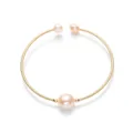 Macro shot of 14K gold-filled spiral wire bracelet with three lustrous pink pearls - Pink