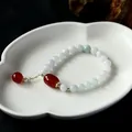 Natural green jade bead bracelet with red agate, pearl, and 14K gold-plated metal accents - Red Agate Pendant Style / Light Green With Red Agate