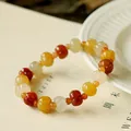 Vintage pumpkin-shaped beaded bracelet with yellow, orange, and white jadeite beads - Pumpkin Bead With Small Spacers