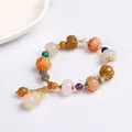 Colorful pumpkin bead bracelet with white gourd pendant and golden flower spacers - Pumpkin Bead Bamboo Gourd Pendant