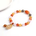 Multicolor natural stone bead bracelet featuring a yellow gourd pendant and gold spacers - Round Bead with Gourd Pendant