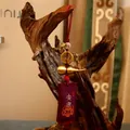 Detailed view of brass gourd charm with Five Emperor coins and red silk tassels - Health (Purple) / Purple