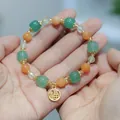 Ethnic pumpkin bead bracelet with green jade and gold Fu charm for good luck - Golden Silk Jade Fortune Plate Pumpkin Bracelet