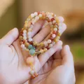 Three-layer natural golden silk jade beaded bracelet with pumpkin tassels and gold accents - Multilayer Golden Silk Jade Pumpkin Bracelet