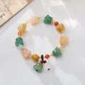 Ethnic style pumpkin bead bracelet with colorful jade-like stones and golden accents - Jade Multi-color Double Lily Bracelet