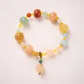 Multi-color Jinsiyu jade bracelet featuring pumpkin beads and golden flower spacers - Lotus Seed Pod Pumpkin Bracelet