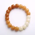Bodhi zaad armband met bruin-amber kleurverloop en gladde trommelvormige kralen - Verweerde Gradiënt Vatkraal
