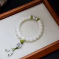 Boeddhistische Bodhi-zaad armband met witte kralen en een groene Fu-hanger - Fu-karakter hanger