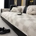 Luxe beige checkerboard sofa cover set with anti-slip texture on black leather couch - 70*70cm / Khaki
