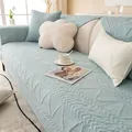 Gesteppte hellblaue Sofabezüge aus Baumwolle mit Wellenmuster auf weißem Sofa - 30x50cm Lendenkissenbezug / Helles Cyan