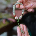 Hetian Nephrite Jade bracelet with plum blossom pendant and green beads for women - White Jade Plum Blossom Cyan Cord Woven