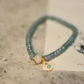 Detailed close-up of blue jadeite beaded bracelet with a diamond-encrusted gourd pendant - Blue Water Abacus Bead White Jade Wheel Bead Turquoise Gourd Style