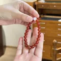 8mm natural red agate bead bracelet for women featuring a white lucky charm and gold detail - Red Agate Auspicious Coin Style / 8mm / Red