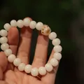 White Bodhi seed bracelet featuring a cute dark brown cat paw bead and round pearls - Charred Cat Paw Style