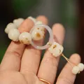 Cat paw Bodhi root bracelet featuring cream beads and purple agate pendant - Charred Cat Paw Handheld Style / 12mm Pearl