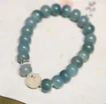 Natuurlijke groene Bodhi-zaden armband met gesneden kraal en kalligrafie tussenstukje - Lichtgroene Zwevende Bloem Konijn Stijl