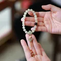 Natural Hetian Jade beaded bracelet for women featuring lotus charms and butterfly pendant - Round Bead Hetian Jade Butterfly Style