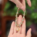 Natural green jade bead bracelet featuring a gold moon and white jade rabbit pendant - Full Spacer Rabbit Prosperity Bracelet