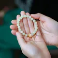Light green Hetian jade beaded bracelet with gold lotus charm for elegant women - Hetian Jade Opal Ruyi Style