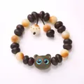 Cat paw white jade bodhi bracelet with dark brown beads and blue-eyed cat pendant - Green Sandalwood / Purple Gold Bowl Verawood Kitten Style