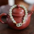 Natural light green jade beaded bracelet with elegant double ring stone pendant - Interlocking