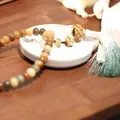 Handcrafted candy-colored Bodhi wood bead bracelet with lotus pendant and silk tassel - Dunhuang Color (Sachet)