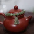 Natural Hetian jade bead bracelet with green Buddha pendant on purple clay teapot base - Hetian Jade Baby Buddha Style