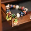 Colorful glazed bead bracelet featuring gold enamel pendants and ethnic style finish - Multicolor Glaze Shiny Mythical Beast