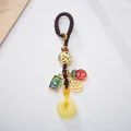 Traditional Chinese keychain with amber-like Pingan buckle and gold dragon bead charm - Everything Goes Well Beeswax Buckle Style
