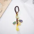 Traditional Chinese amber gourd keychain with lucky coins and woven strap design - Beeswax Gourd Style