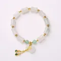 Bamboo style beaded bracelet with white bone beads and gold fortune bag charm pendant - 8*12MM Tianshan Green Large Bamboo Money Bag Style