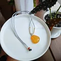 Natural yellow chalcedony Buddha pendant necklace with light grey woven cord - Silver Gray Red Chalcedony Maitreya Buddha Necklace