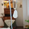 Translucent white chalcedony gourd pendant with light blue cord and gold spacer beads - Silver Gray Chalcedony Gourd Necklace