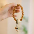 Pulsera de semillas de Rudraksha de Nepal con hebilla de jade y colgante de loto tallado - Pulsera Rudraksha con Borla y Anillo / León Despierto (MNSL16-01)