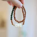 Double-layer sandalwood bracelet featuring green jade beads and a carved beast pendant - Sandalwood Jade Tara Style