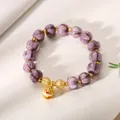 Purple carved glass bead bracelet with golden lion dance charm and accent spacers - Twilight Purple Glazed Glass Fish Bell Bracelet