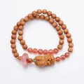 Ethnic style sandalwood bracelet featuring red agate beads and a carved wood pixiu charm - Sandalwood Red Agate Style