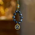 Detail of blue ceramic beads and gold-plated pendant in New Chinese style hanging - Blue Incense Ash Porcelain - Blue Wealth God