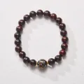 Macro shot of 8mm sandalwood beads with golden lacquer inlay and metallic spacers - Blue Lacquer Bead Sandalwood