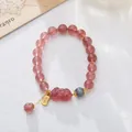 Pink natural strawberry quartz beaded bracelet with gold money charm and carved Pixiu mascot - Strawberry Crystal Pixiu Tassel Style