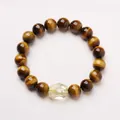 Detailed view of 10mm tiger eye beads and faceted citrine crystal on a beaded bracelet - Tiger Eye Citrine Bracelet