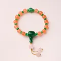 Classical 18-seed pink crystal bracelet with orange-red beads and green accents - National Trend Design Style